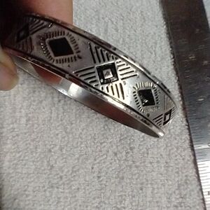 Silvertone black bangle bracelet approx. 2.5
